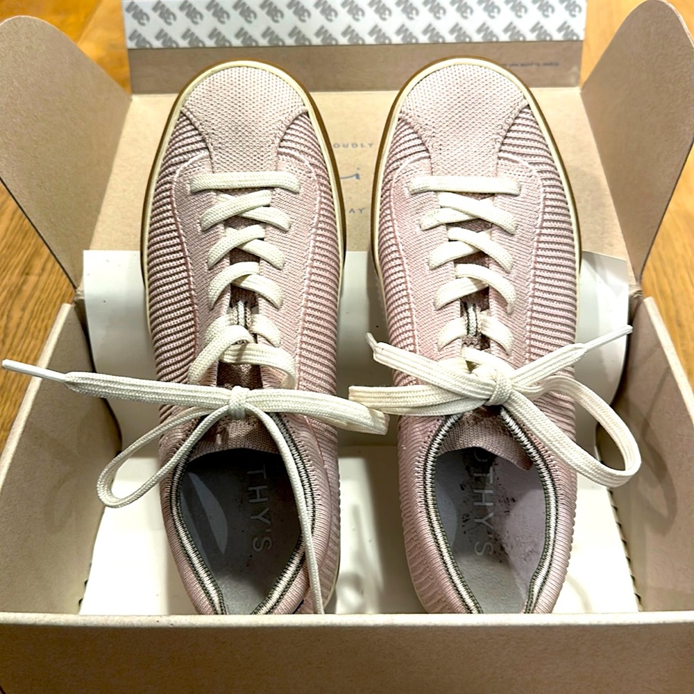 Rothy’s tennis shoes (washable in washing machine). Comes with the original box.